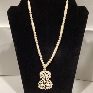 Elegant Cream Beaded Necklace with Intricate Pendant
